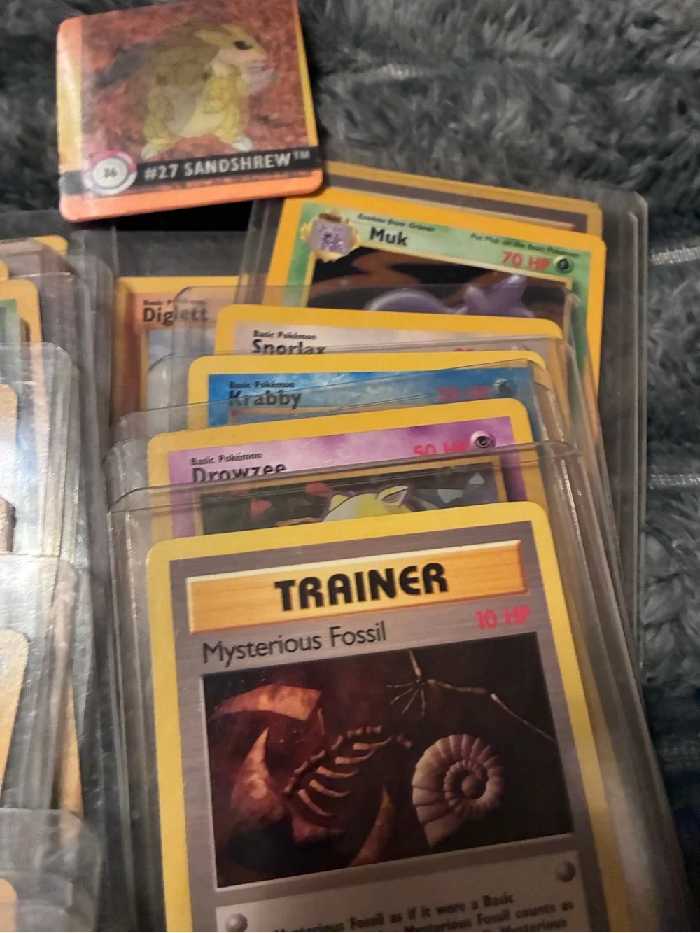 Pokemon Trading Card Lot - Assorted Colors 1997-98 trading cards in plastic hold